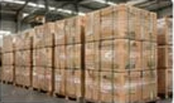 Custom export cartons stacked on pallets