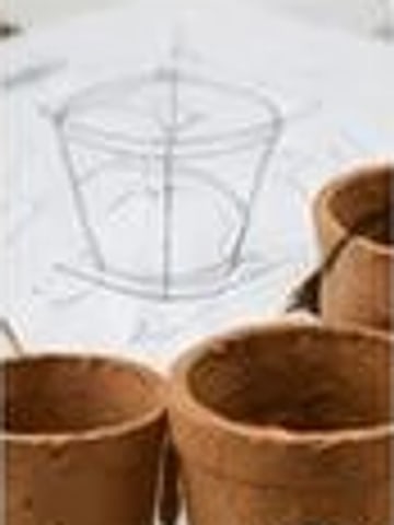 Sketch of a custom coir pot beside finished pots